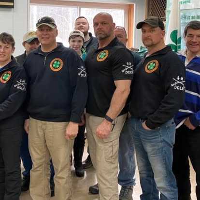 4-H Shooting Sports instructor team at the range — the foundation of precision shooting instruction